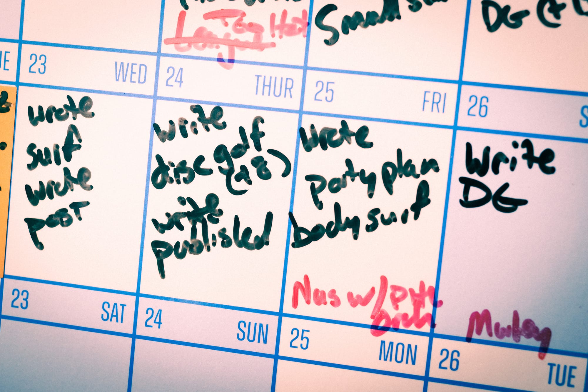 Close up photo of a calendar with tasks written on it.