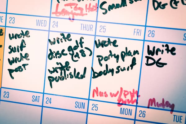 Close up photo of a calendar with tasks written on it.